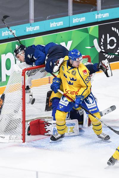 Finland's Otto Karvinen finds himself in an unusual position during the Karjala Cup clash against Sweden on Sunday, November 8. Reuters