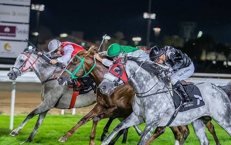 Tadhg O’Shea on AF Majalis, nearest to the camera, wins in a tight three-horse finish at Abu Dhabi on Thursday, January 12, 2023. Photo: Adiyat Racing Plus