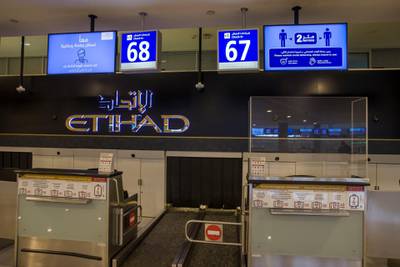 Plastic barriers around the check in area protecting both staff and passengers. Courtesy of Etihad Airways
