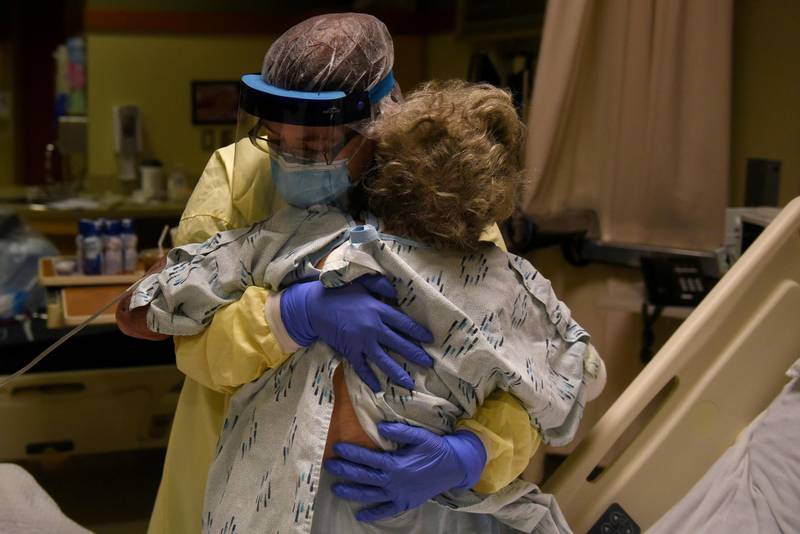 Healthcare personnel prepare to discharge a patient who had been quarantining after a possible exposure to the Covid-19 at a hospital in Lakin, Kansas, on November 19, 2020. Reuters
