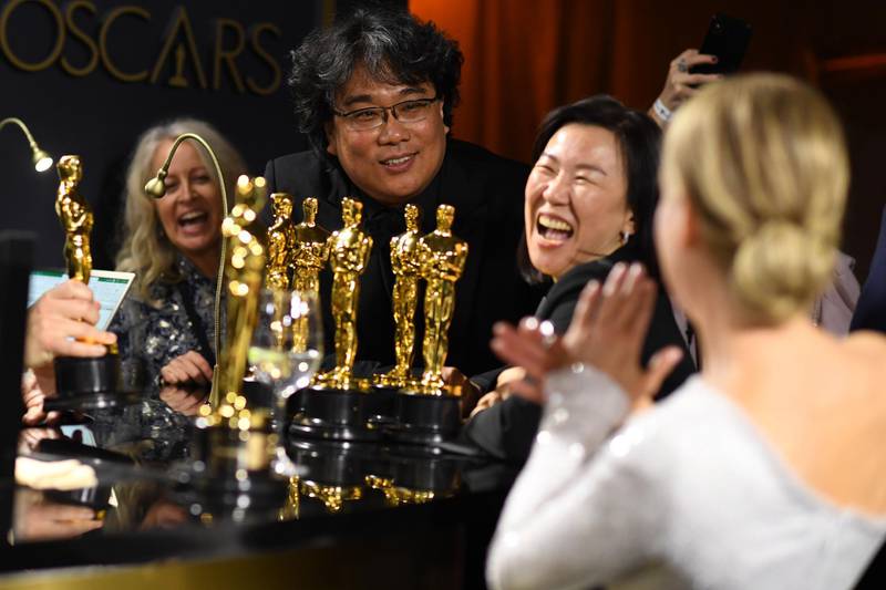 Bong Joon-ho, producer Kwak Sin-ae and Renee Zellweger have a laugh at the Governors Ball after the Oscars on Sunday, February 9, 2020, at the Dolby Theatre in Los Angeles. AFP