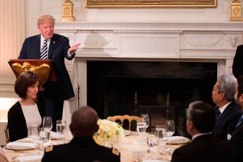 US President Donald Trump speaks during an iftar dinner hosted at the White House in Washington, DC, on June 6, 2018. Donald Trump hosts his first iftar dinner as president, marking the traditional Ramadan fast-breaking meal with Muslim invitees at the White House. / AFP / JIM WATSON
