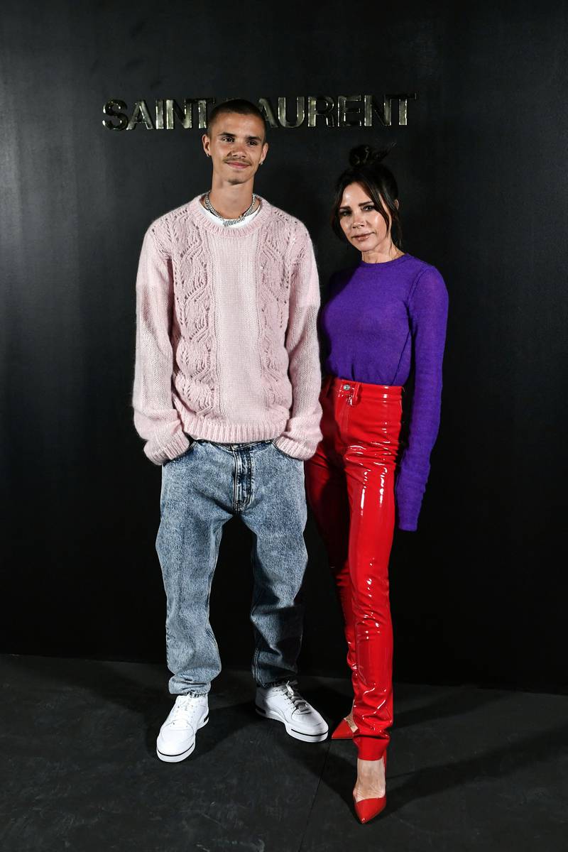 British singer and designer Victoria Beckham and her son Romeo before the Saint Laurent womenswear autumn/winter 2022-2023 show at Paris Fashion Week. AFP