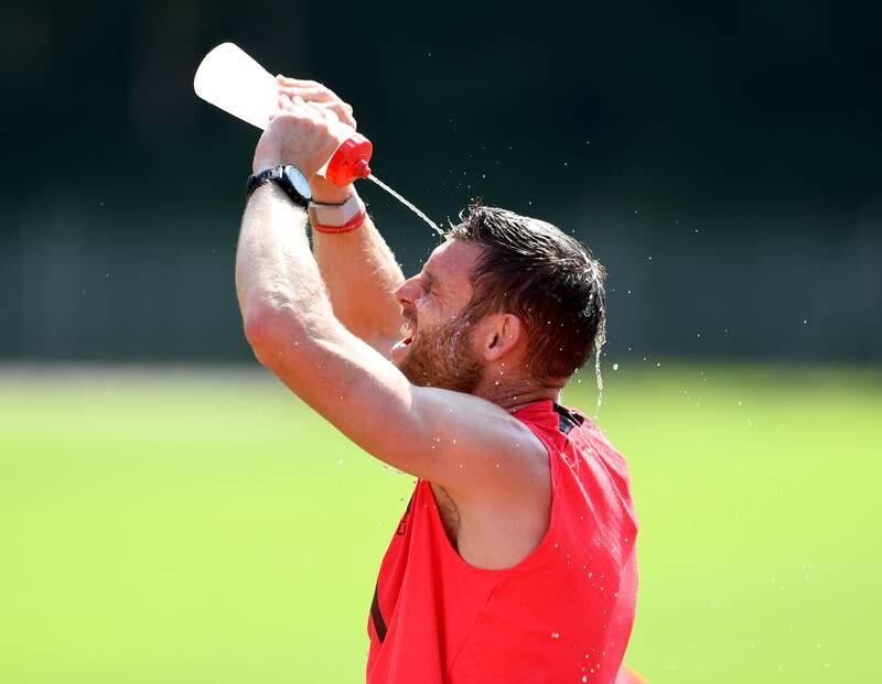 James Milner tries to cool down after the training session. 