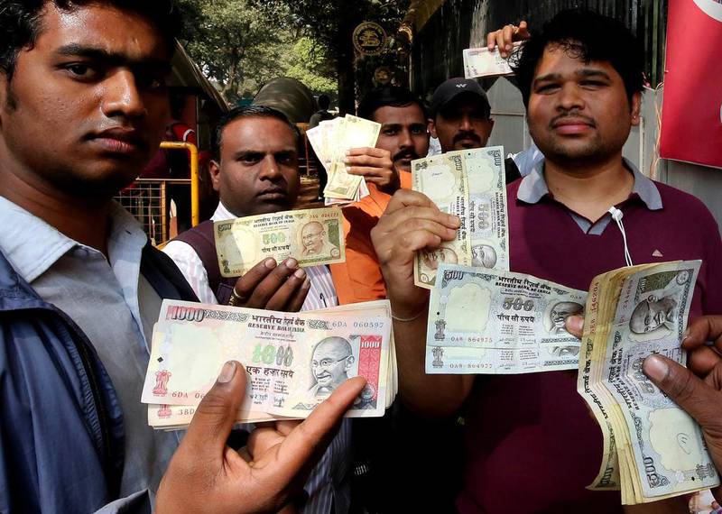 Indians line up outside the Reserve Bank of India to deposit the old rupee notes. The Modi government in November scrapped 500 and 1,000 rupee notes in an effort to crack down on black money. Jagadeesh JV / EPA