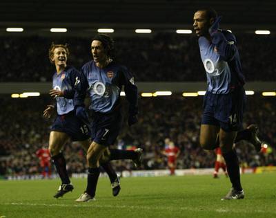LIVERPOOL - JANUARY 29:  Robert Pires of Arsenal celebrates after scoring the first goal with Thierry Henry of Arsenal during FA Barclaycard Premiership match between Liverpool and  Arsenal held on January 29, 2003 at Anfield in Liverpool, England.  The match ended in a 2-2 draw. (Photo by Gary M. Prior/Getty Images)