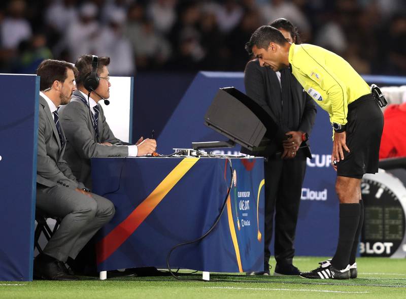 ABU DHABI, UNITED ARAB EMIRATES - DECEMBER 13:  Referee Sandro Ricci looks at the video footage during the FIFA Club World Cup UAE 2017 semi-final match between Al Jazira and Real Madrid on December 13, 2017 at the Zayed Sports City Stadium in Abu Dhabi, United Arab Emirates.  (Photo by Francois Nel/Getty Images)