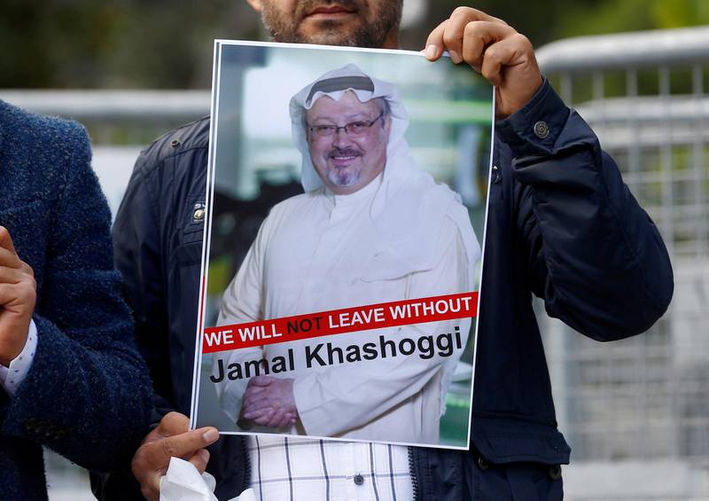 FILE PHOTO: A demonstrator holds picture of Saudi journalist Jamal Khashoggi during a protest in front of Saudi Arabia's consulate in Istanbul, Turkey, October 5, 2018. REUTERS/Osman Orsal/File Photo