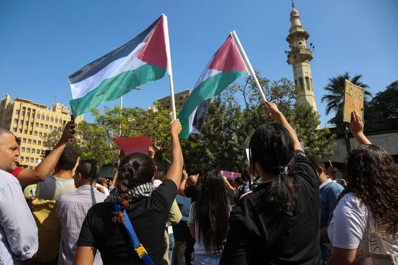 Pro-Palestinian demonstrators wave flags outside the Mostafa Mahmoud mosque in Cairo following Friday prayers. Bloomberg. 