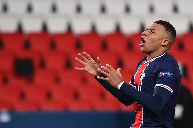Paris Saint-Germain's French forward Kylian Mbappe reacts after missing a goal opportunity during the UEFA Champions League group H football match between Paris Saint-Germain (PSG) and Istanbul Basaksehir FK at the Parc des Princes stadium in Paris, on December 9, 2020.  / AFP / FRANCK FIFE
