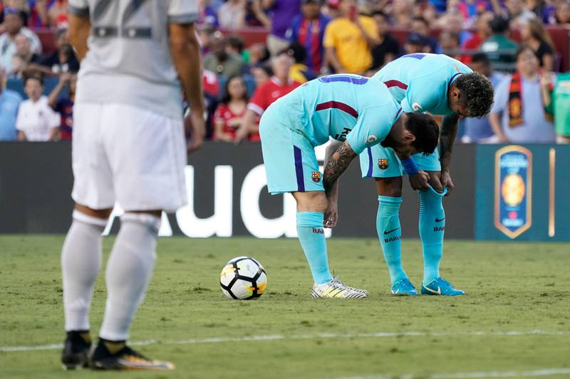Barcelona's Neymar, right, with teammate Lionel Messi set up for a free kick against the Manchester United during the first half of their International Champions Cup match at Fedex Field in Landover, Maryland, USA, 26 July 2017.  Shawn Thew / EPA