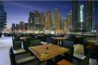 The terrace at Zafran in Dubai's Marina Mall is lit up at night and the atmosphere is intimate, rather than sterile or with a shopping mall feel.
