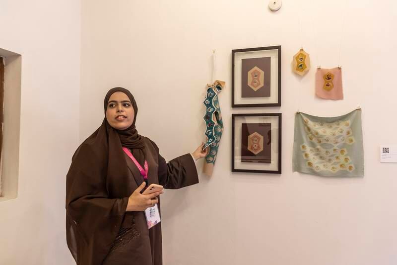 Ayesha bin Haider with her series of textile works inspired by henna designs. Antonie Robertson / The National