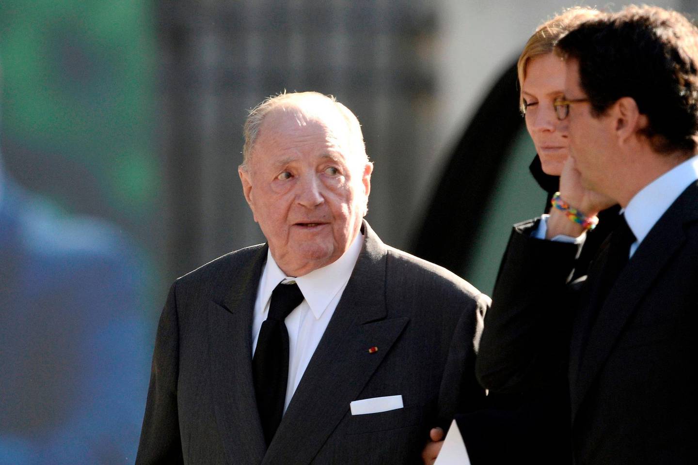 (FILES) In this file photo taken on October 27, 2014 Belgian businessman Albert Frere (L) leaves after attending the memorial service for Total's CEO Christophe de Margerie at the Saint-Sulpice church in Paris.  Belgium's richest man, multi-billionaire entrepreneur Albert Frere, has died aged 92, his investment company GBL announced on December 3, 2018. / AFP / STEPHANE DE SAKUTIN
