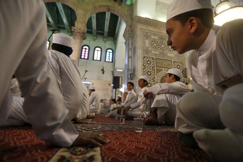 Syrians pray at the Umayyad Mosque in Damascus.
