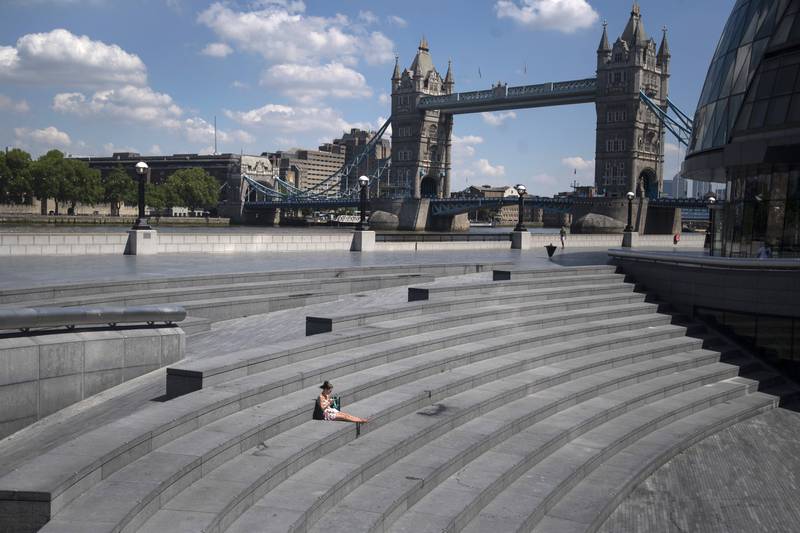 There are claims that Prime Minister Boris Johnson's aide organised a Downing Street drinks party on May 20, 2020, during the country's first lockdown. Here we take a look back to see what the UK looked like on that day in 2020. A solitary woman sits near Tower Bridge in London. PA