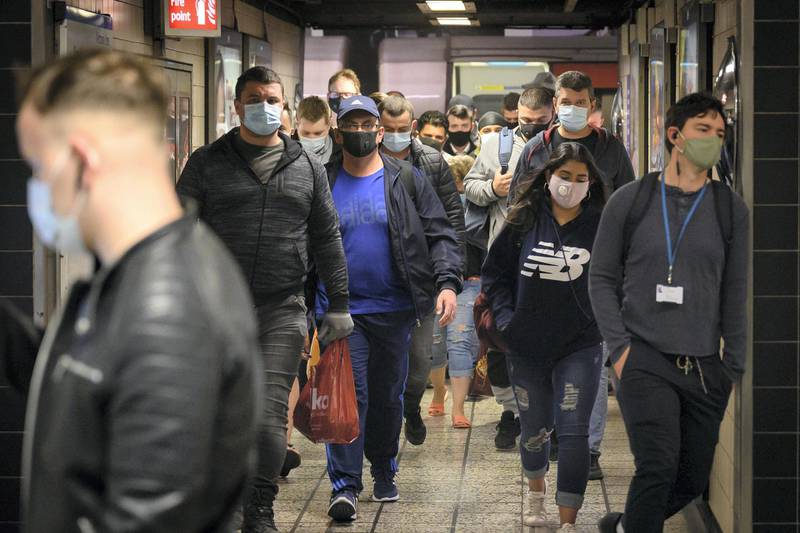 LONDON, ENGLAND - JUNE 15: Commuters wear face masks as they pass through Vauxhall underground station on the first day of their mandatory use while travelling on public transport, on June 15, 2020 in London, England. The British government have relaxed coronavirus lockdown laws significantly from Monday June 15, allowing zoos, safari parks and non-essential shops to open to visitors. Places of worship will allow individual prayers and protective facemasks become mandatory on London Transport. (Photo by Leon Neal/Getty Images)
