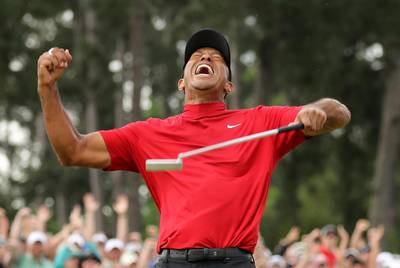 Tiger Woods celebrates on the 18th hole to win the US Masters, his fifth title at Augusta and his first since 2005. Lucy Nicholson / Reuters