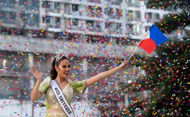 Miss Universe 2018 Catriona Gray of the Philippines waves to fans during a parade held in her honour in Manila on February 21, 2019, two months after she won the crown.  / AFP / Noel CELIS
