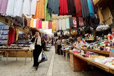 Shopping in the West Bank city of Hebron. Income this year is expected to stagnate as economic growth slows, according to the World Bank. EPA