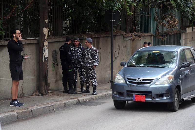 Lebanese policemen stand guard near the parking access doors of the property of Carlos Ghosn. Bloomberg