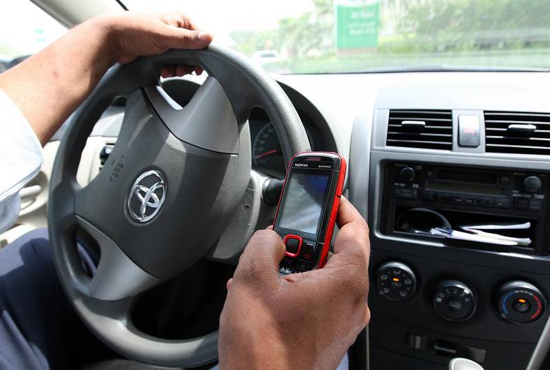 Motorist continue to use mobile phones while driving in the UAE, despite various traffic awareness campaigns. Photo: Pawan Singh / The National