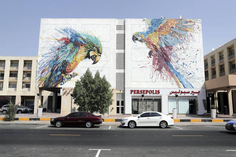 DUBAI , UNITED ARAB EMIRATES, September 20 , 2018 :- Artwork painted by different artists on the wall of Wasl Properties at the Karama shopping complex in Al Karama area in Dubai. ( Pawan Singh / The National )  For Big Picture/Online/Instagram