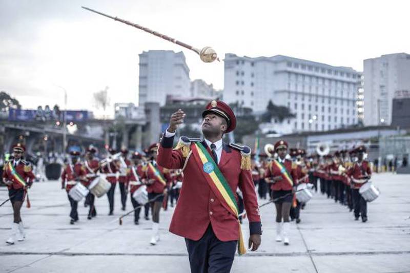 A drum major of the Republican March Band leads performers during the rally.