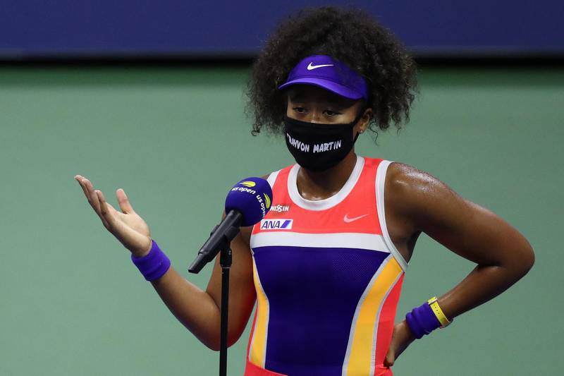 Naomi Osaka talks in a post match interview wearing a mask with the name of Trayvon Martin printed on it after her fourth round match win against Anett Kontaveit. AFP