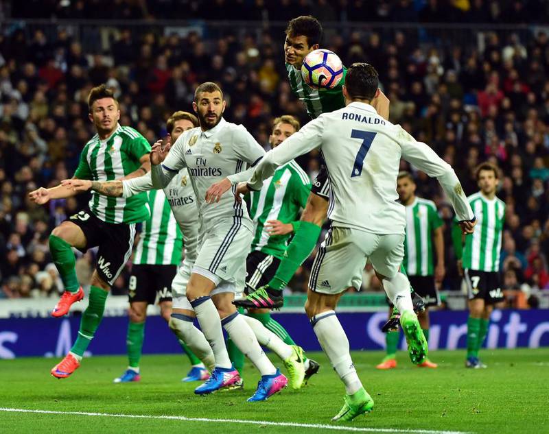 Real Madrid’s Portuguese forward Cristiano Ronaldo, right, vies with Betis’ Serbian midfielder Aissa Mandi. Gerard Julien / AFP