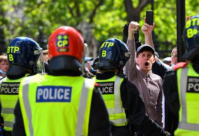 A counter-protester gestures in front of police officers during a Black Lives Matter demonstration in London. Reuters