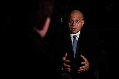 An anti-vax campaigner has been charged following a protest outside UK Health Secretary Sajid Javid's home in Fulham, south London. PA