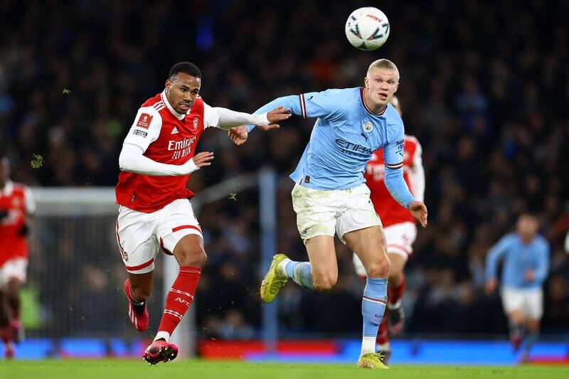 Erling Haaland of Manchester City battle for possession with Gabriel of Arsenal. Getty