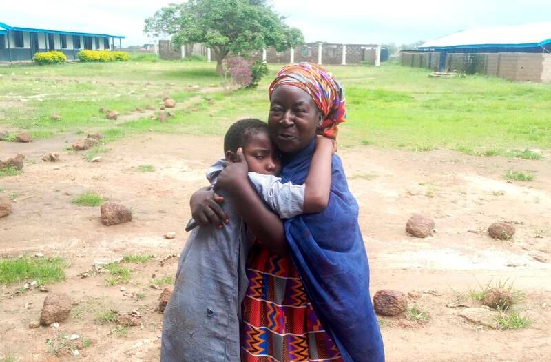 A mother is reunited with a Bethel Baptist High School pupil released by gunmen in Damishi, Nigeria, on Sunday. AP