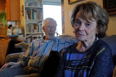 Cynthia Flagg (right) sits with her husband Charles, who took part in an early stage trial of Biogen's drug Aducanumab following his diagnosis with Alzheimer's disease, at their home in Jamestown, Rhode Island, US, February 21, 2020. Reuters