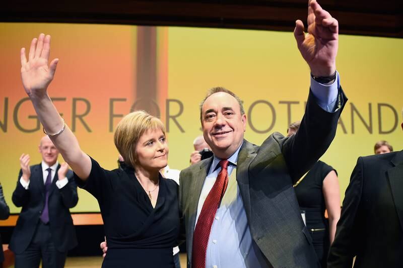Former first minister of Scotland Alex Salmond with Ms Sturgeon following his last key note speech as party leader in November 2014 in Perth. Getty