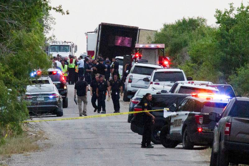 Police officers at the scene where at least 46 people, thought to be migrants, were found dead inside the trailer of a lorry in San Antonio, Texas, on June 27.  Reuters