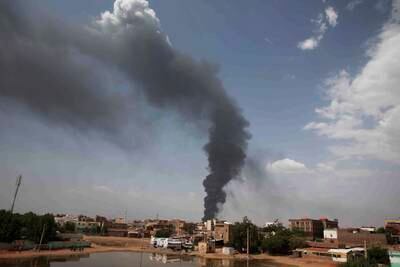Smoke rises over Khartoum on Thursday as fighting continues. AP
