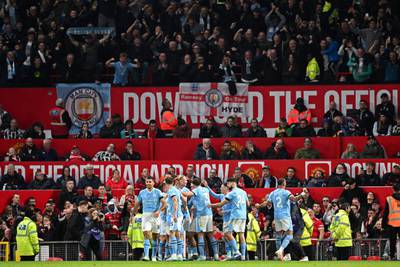 Manchester City's players celebrate going 2-0 ahead at Old Trafford. AFP