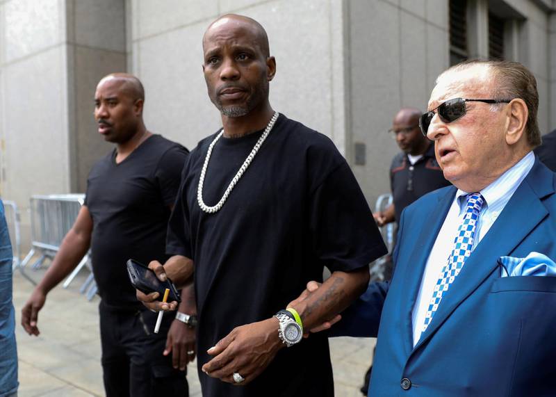 FILE PHOTO: Earl Simmons (C), also known as the rapper DMX, exits the U.S. Federal Court in Manhattan following a hearing regarding income tax evasion charges in New York City, U.S., July 17, 2017. REUTERS/Brendan McDermid/File Photo