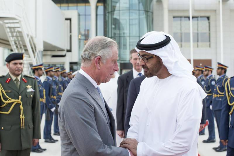 Sheikh Mohammed bin Zayed, Crown Prince of Abu Dhabi and Deputy Supreme Commander of the Armed Forces, greets Britain’s Prince Charles at the Presidential Airport on Thursday during his tour of the region. Ryan Carter / Crown Prince Court – Abu Dhabi  