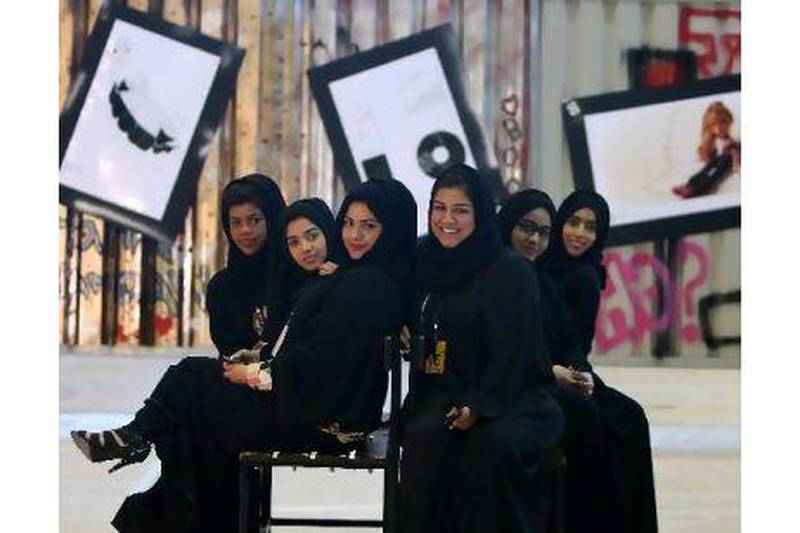 From left, Asma Obaid, Maitha al Haddad, Maryam Sayed, Salma al Saadi, Mirah Ahmed and Fatma al Bastaki during the opening of the exhibition at Dubai Women's College. Pawan Singh / The National