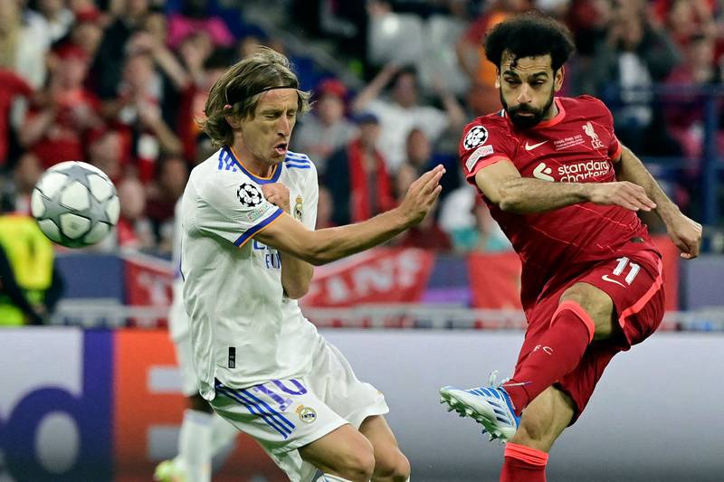Liverpool's Mohamed Salah fires a shot past Real Madrid's Croatian midfielder Luka Modric. AFP