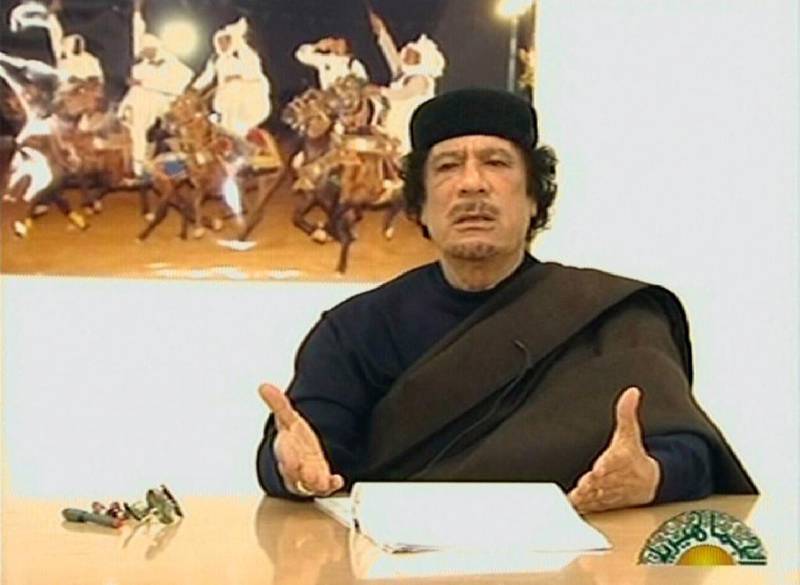 Four years after Qaddafi’s death, Libya is not substantially better off and the current state of affairs in the country makes it almost logical to speculate what would have happened if he was still alive. Libyan TV / AFP