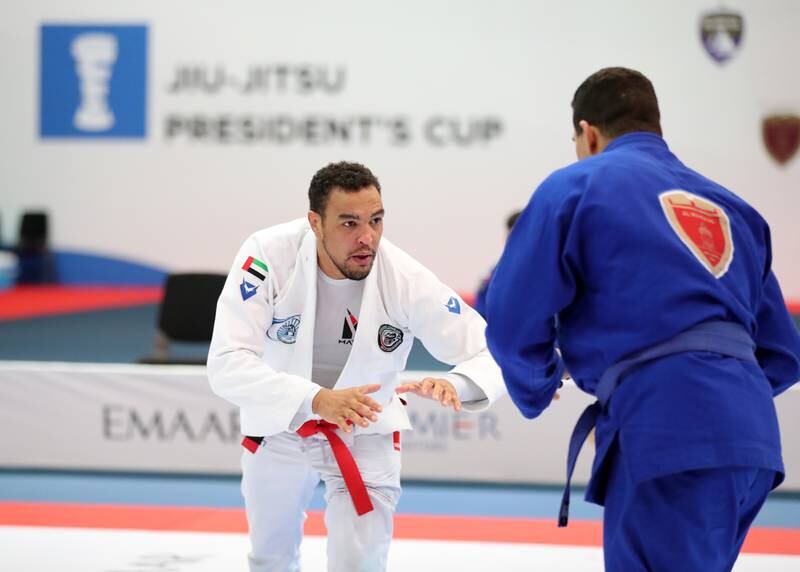Faisal Al Ketbi of Baniyas, left, in the men's final of the President's Cup jiu-jitsu at the Jiu-Jitsu Arena at Zayed Sports City, Abu Dhabi, on April 24, 2022. Baniyas made it a hat-trick of wins in the men's competition. Baniyas' women's team recorded a double at the event. All photos: Chris Whiteoak / The National