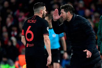 Diego Simeone, right, gives instructions to midfielder Koke. AFP