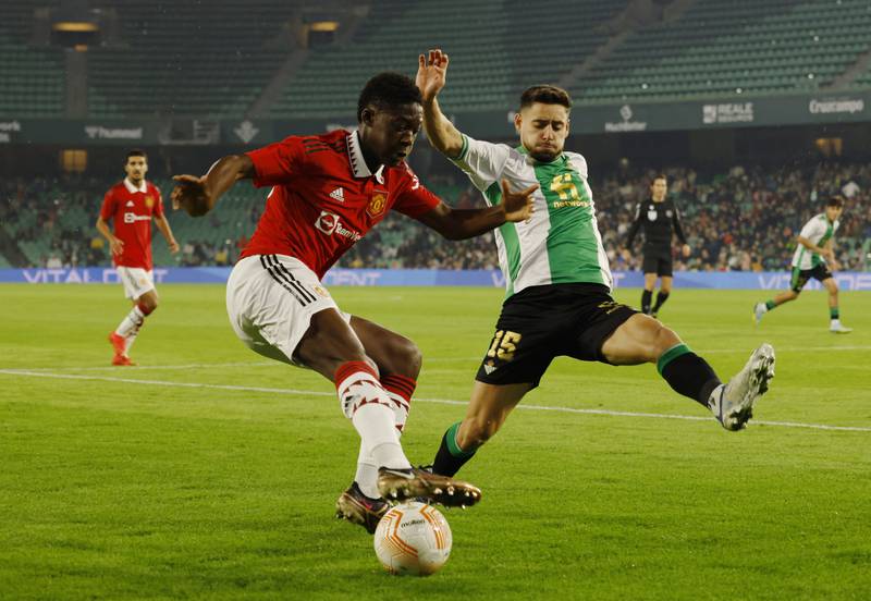 Manchester United's Kobbie Mainoo in action with Real Betis' Alex Moreno. Reuters
