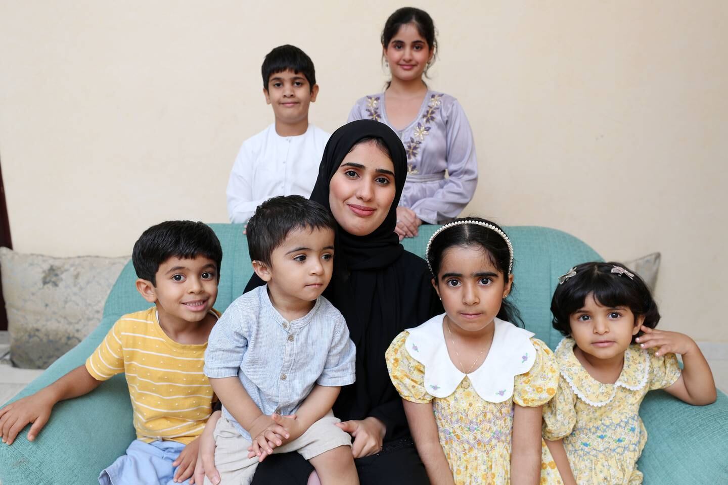 Mozoon Khalifa Al Ketbi, with her four nieces and nephews and two siblings. Chris Whiteoak / The National