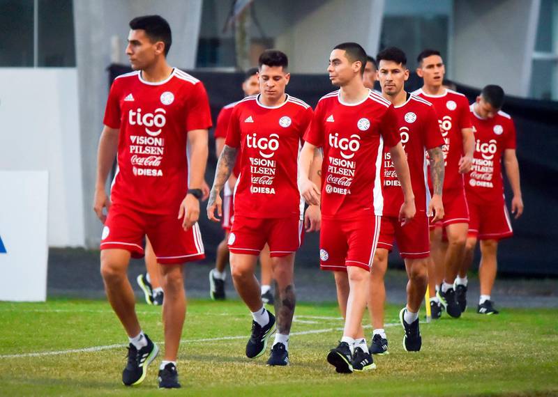 Paraguay players, among them Junior Alonso, left, and Miguel Almiron, third left, take part in a training session. AFP