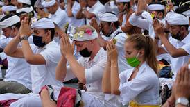 Bali holds mass prayers as it prepares to reopen to tourists following coronavirus closure 